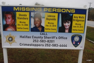 Reynolds photo is featured on a sign seeking information on the missing in Halifax County.