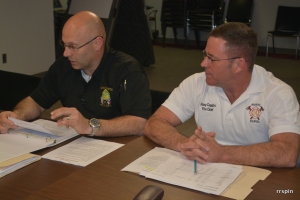 Coggins, right, with police Chief Chuck Hasty who also presented this afternoon.