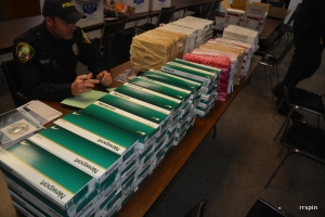 Hardy takes inventory of the cigarettes.