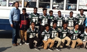 Cunningham with members of the Enfield middle football team.
