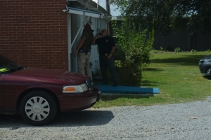Hasty, right, and Investigator Jamie Hardy check the back of the establishment.