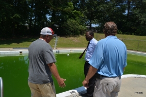 Ferebee, center, and Simeon, right, discuss the pool with Mike Manning of the parks department last month.