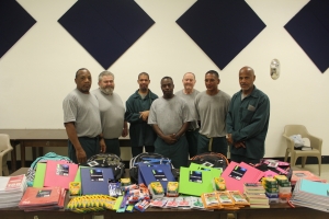 Odom staff, inmate service club donate school supplies