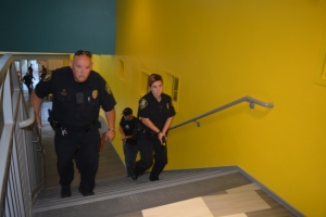 Officers go upstairs during the drill.