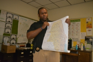 Scott shows officers a map of the county where sex offenders are located.