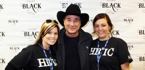 BarnBurner Promotions co-owners Julie Powell and Allison Mckee Askew pose with Clint Black before Saturday&#039;s show.